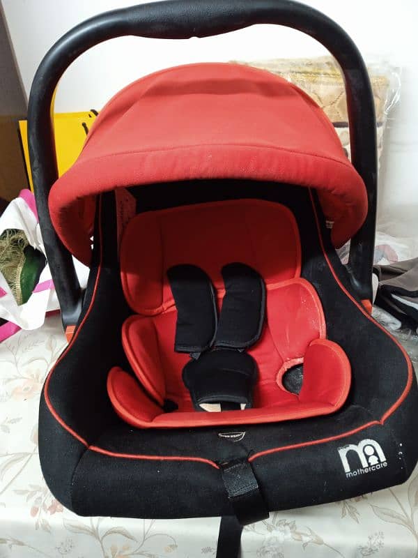 mother care baby carry cot for sale in a good condition. 3