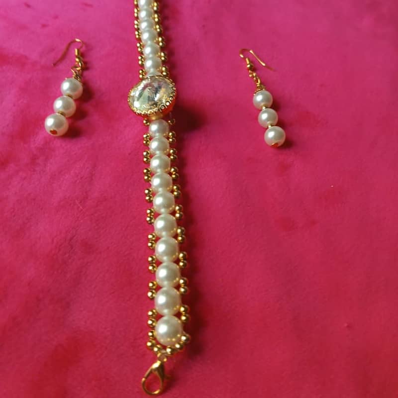 Pearl Bracelet with earrings Rs:450 only 2