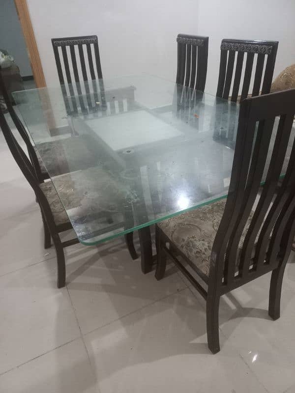 Used Dining Table for sale, Glass 12mm, wooden stand , chairs 0