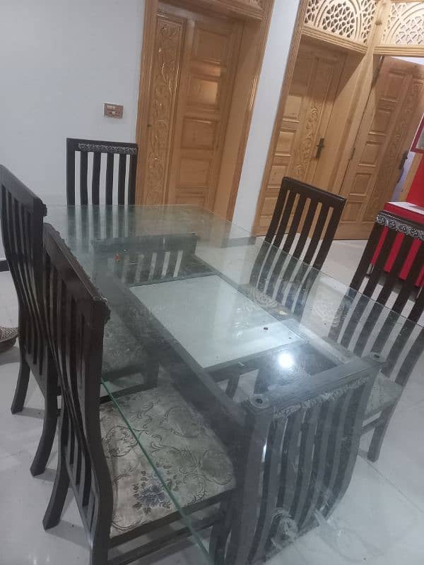 Used Dining Table for sale, Glass 12mm, wooden stand , chairs 7