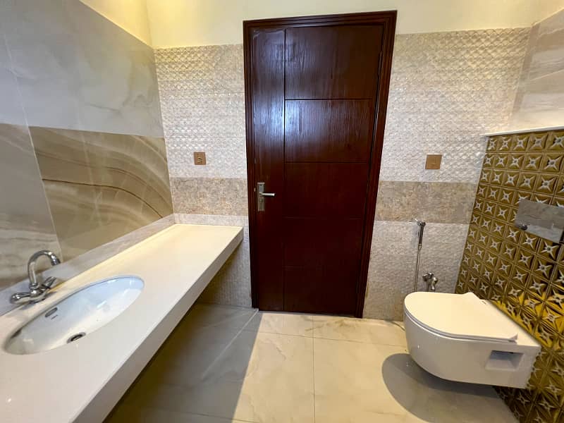 Luxury And Comfort Unite In This 4-Bedroom Residence In DHA 9 Town Block A" 2