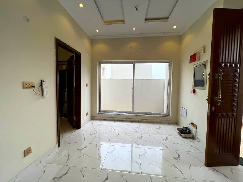 Luxury And Comfort Unite In This 4-Bedroom Residence In DHA 9 Town Block A" 12