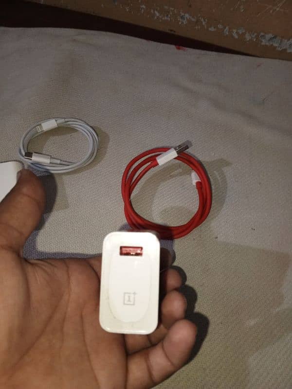 oneplus and iphone charger lush condition 3