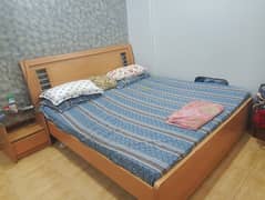 Bed with mattress and side tables and dressing