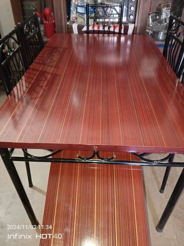 6 chair iron dining table good condition . 1