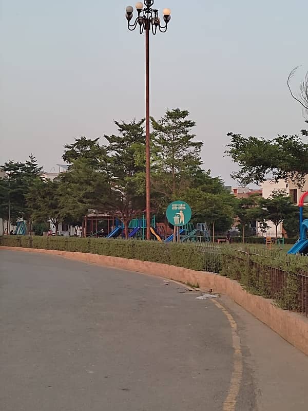 Facing Park 10 Marla Plot For Sale In Diamond Block, Park View City Lahore 1