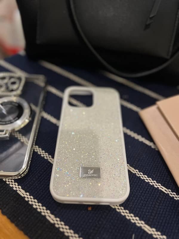 Iphone 16 pro max SWAROVSKI cases original with box 4