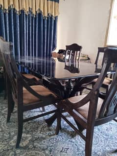 dining with 5 wooden chairs . in used condition