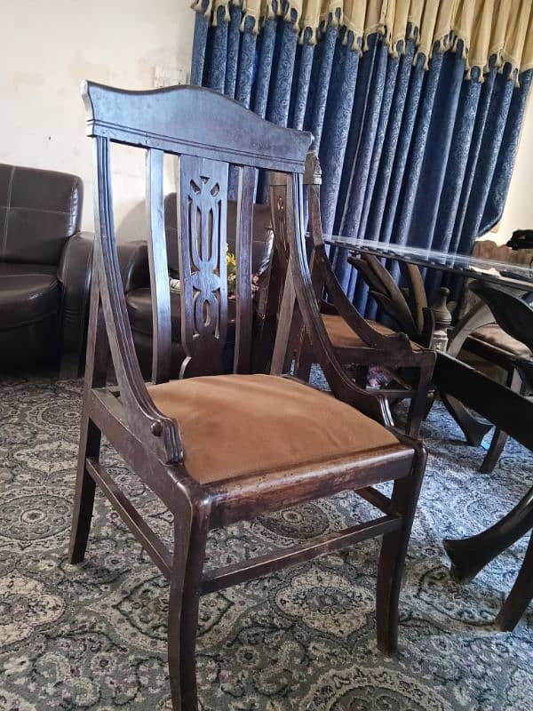 dining with 5 wooden chairs . in used condition 1