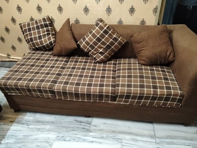 L shape sofa with 8 cusions and centre tabel 2