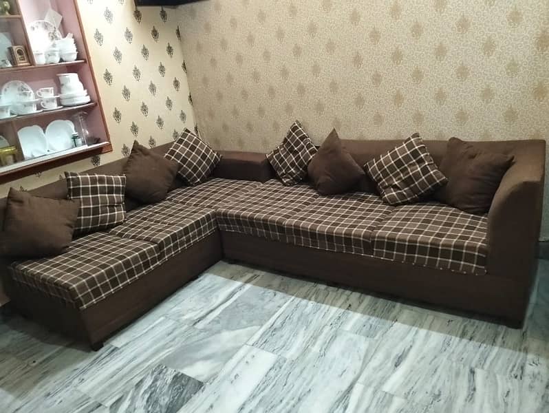 L shape sofa with 8 cusions and centre tabel 4