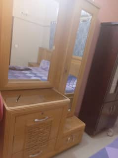 king bed without matters.    side tables dressing and 3 door cupboard