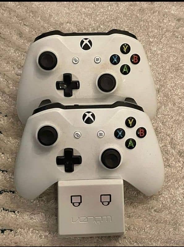 X-box one with two controllers and head phone 3