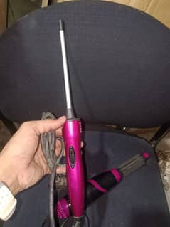 branded good condition hair dryer and hair curly