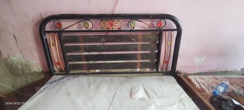 single iron bed with mattress. 0