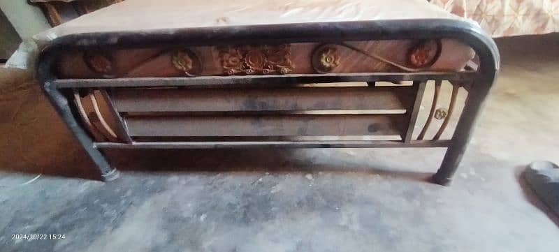 single iron bed with mattress. 1