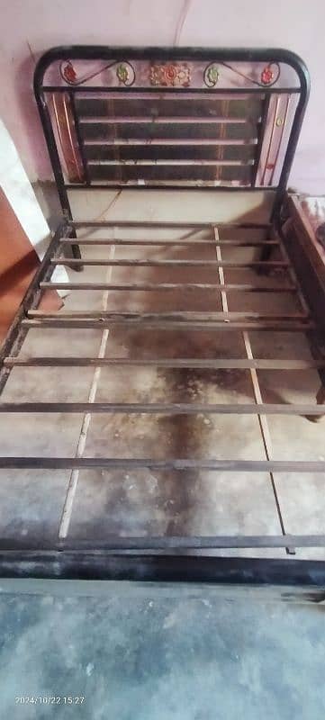 single iron bed with mattress. 2