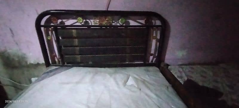 single iron bed with mattress. 5