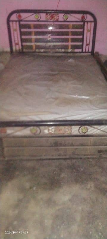 single iron bed with mattress. 7