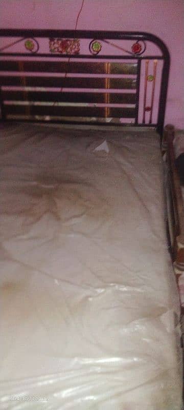 single iron bed with mattress. 8