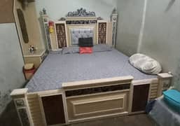 King size bed dressing wardrobe and crockery unit.