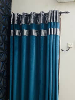 Sea blue and silver colored velvet curtains