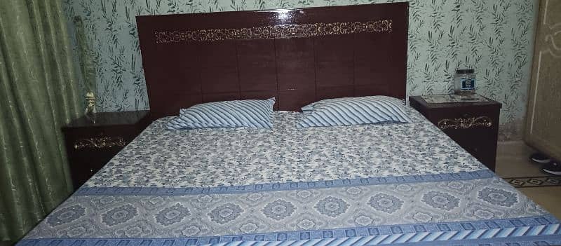 Wooden bed set with side tables. 5