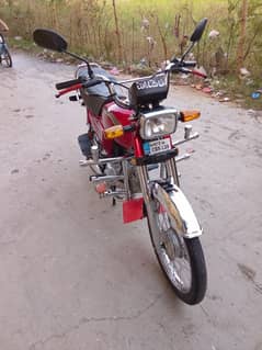 Honda CD 70 model 2023 Islamabad number lush condition ma hai.