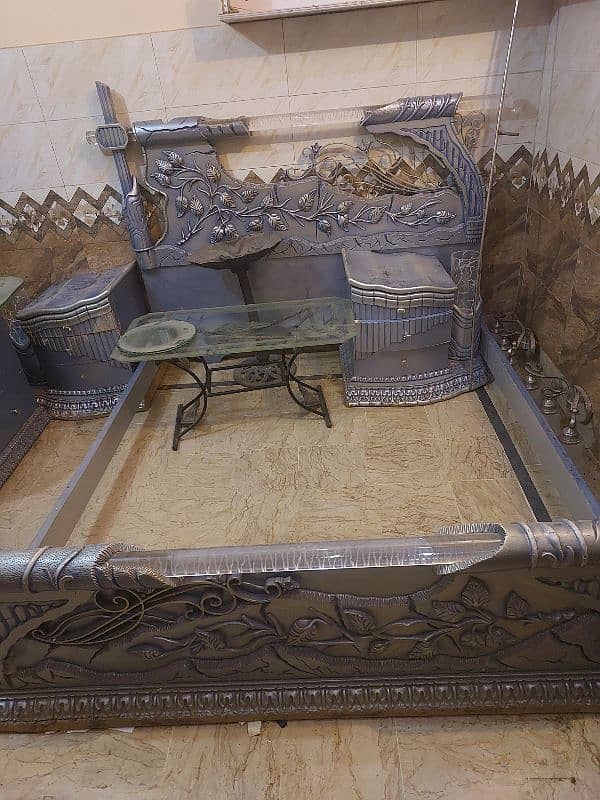 king bed with 2 side table and dressing 0