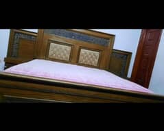 bed with mattress and dressing table