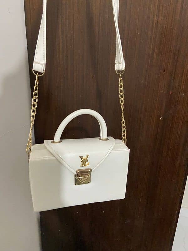 white Ysl branded bag 1