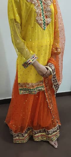 Orange net lehnga with kurta