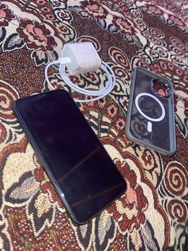 iPhone 11 with charger 1