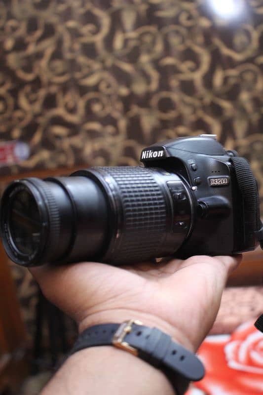 Nikon d3200 with 55/200mm Dx. 1