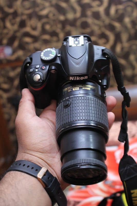 Nikon d3200 with 55/200mm Dx. 2