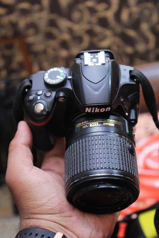 Nikon d3200 with 55/200mm Dx. 6