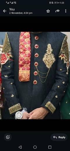 black sherwani with khussa and qulla