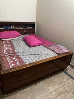 Original wooden bed with mattress