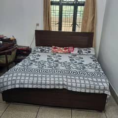 Brown wooden bed