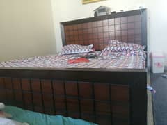 king size wooden bed with mattress