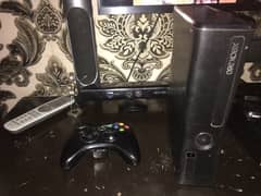 xbox 360 silm 200gb and 19 games and camera