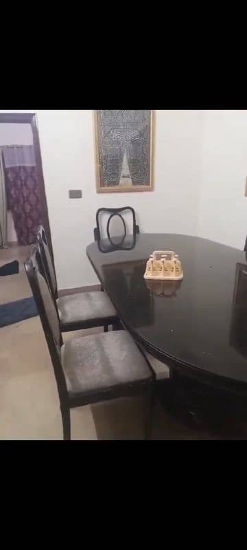 black heavy wooden dining table 6 chairs good condition urgent sale 0