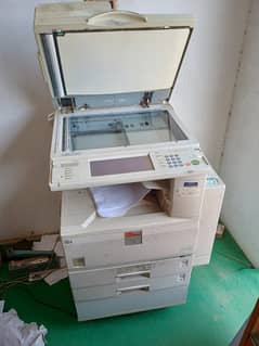 Photocopy machine in good running condition urgently selling only 50k