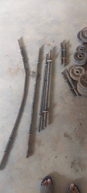 weight plates dumbles and rods 0