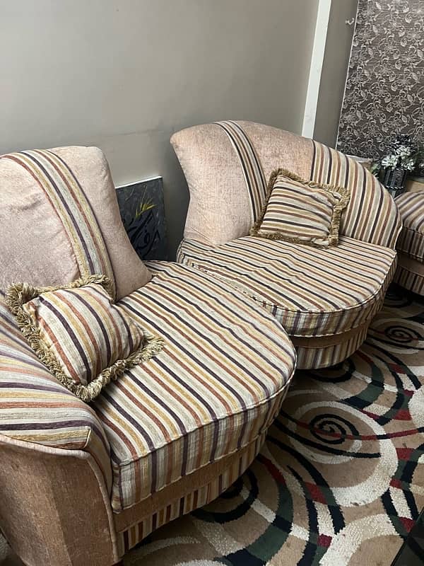 7 seater sofa set with 6 cushions and a red settee 1