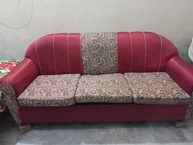 3 seater maroon color sofa 0