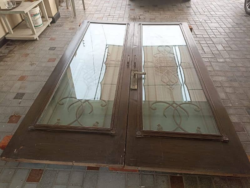 wooden door with glass and grill 0