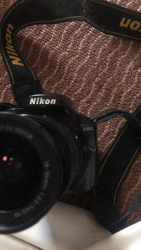 Nikon D3400 10/10 with lens 0