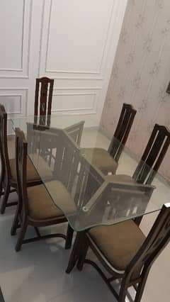 one glass table and 6 chair in good condition negotiablr