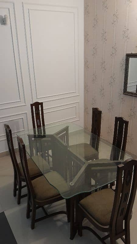 one glass table and 6 chair in good condition negotiablr 1